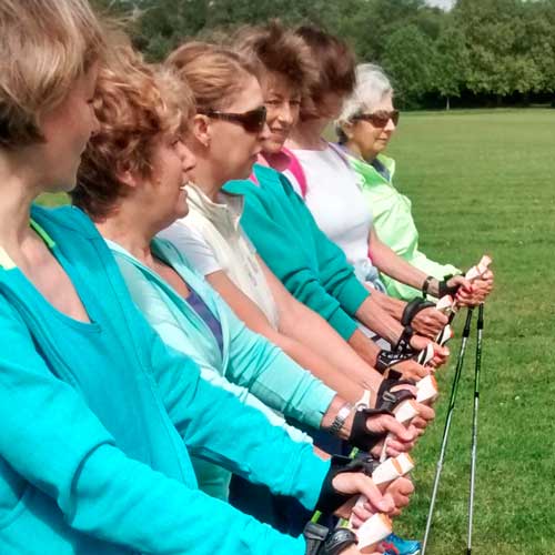A line of Ladies on Wandsworth Common with their nordic walking poles